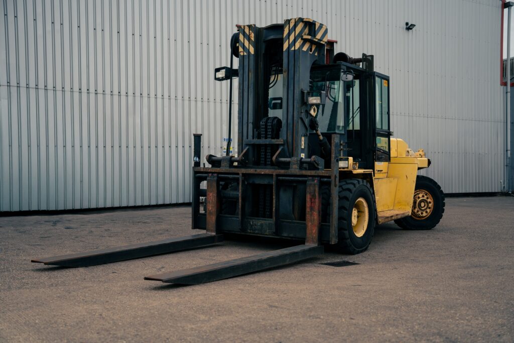 Heavy-duty forklift operating at IM Export Services facility.