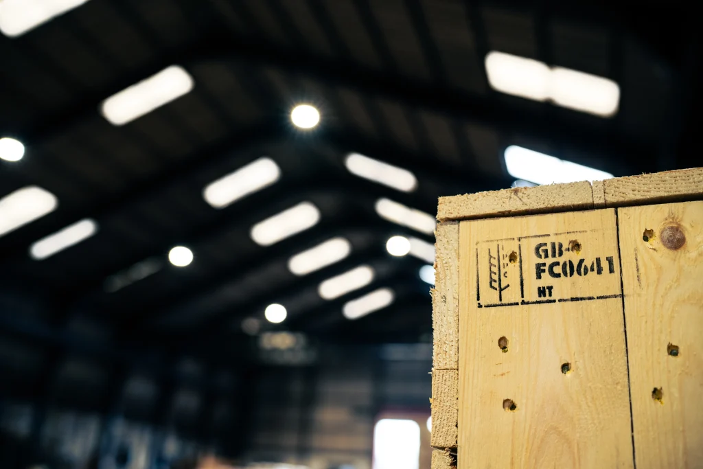 ISPM 15 stamped timber export crate inside IM Export Services warehouse.