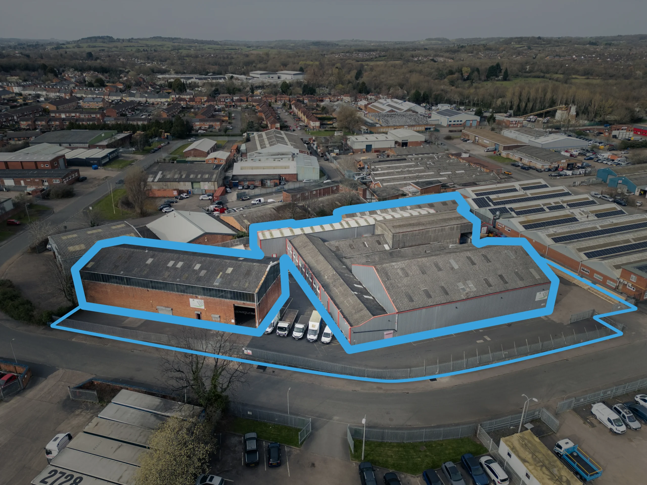 An aerial photograph of the IM Freight Forwarding Headquarters, the property boundary and buildings outlined in blue.